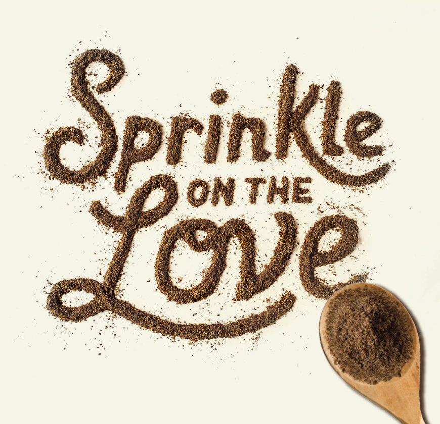 Sprinkle on the love spelled out with Missing Link supplement powders and a wooden spoon with powder still in it.